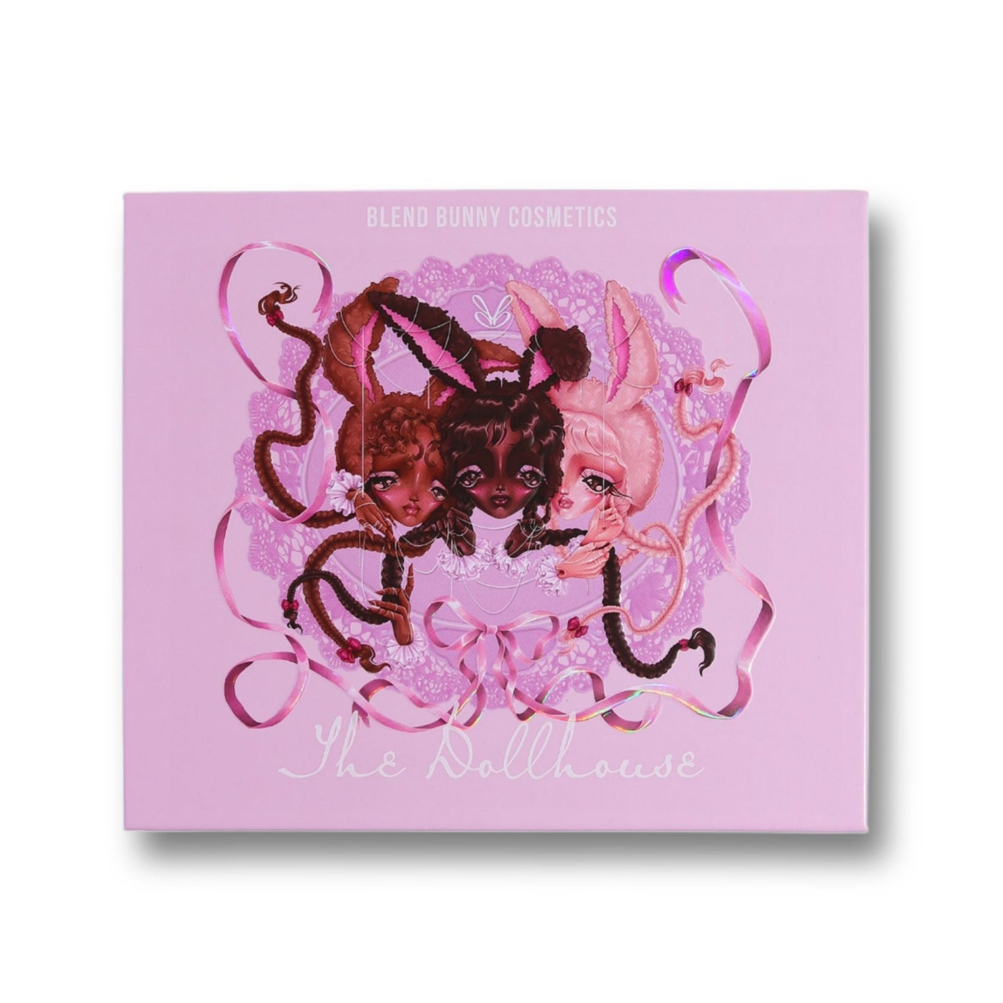The Dollhouse closed palette, lilac cover with three bunny-eared doll figures, ribbons, and lace artwork