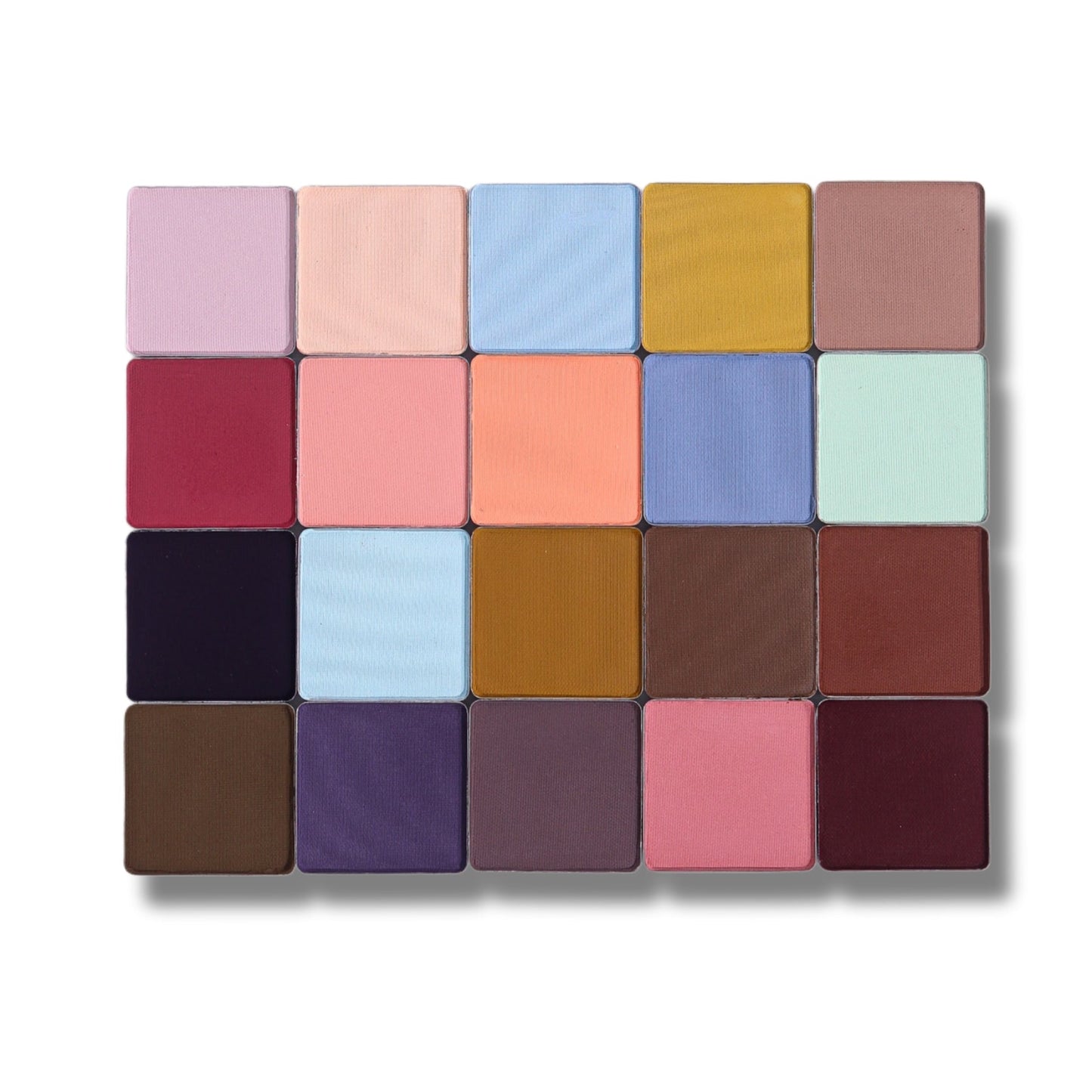 Close-up of the 20 Fauna matte pans across lilacs, blues, mustard, berries, browns, and plums
