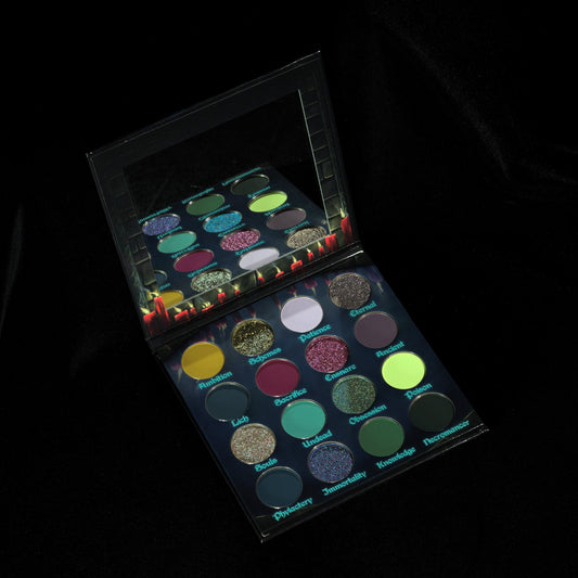 Fantasy Cosmetica Harvest of Souls eyeshadow palette open, 16 shades of greens, purples, and blues with holochromes and duochromes