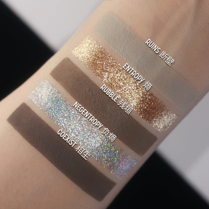 BellaBeauteBar Yin & Yang palette shade swatches — Ruins, Entropy, Rubble, Negentropy, and Coexist — gold and bronze glitters with holographic silver and matte taupe