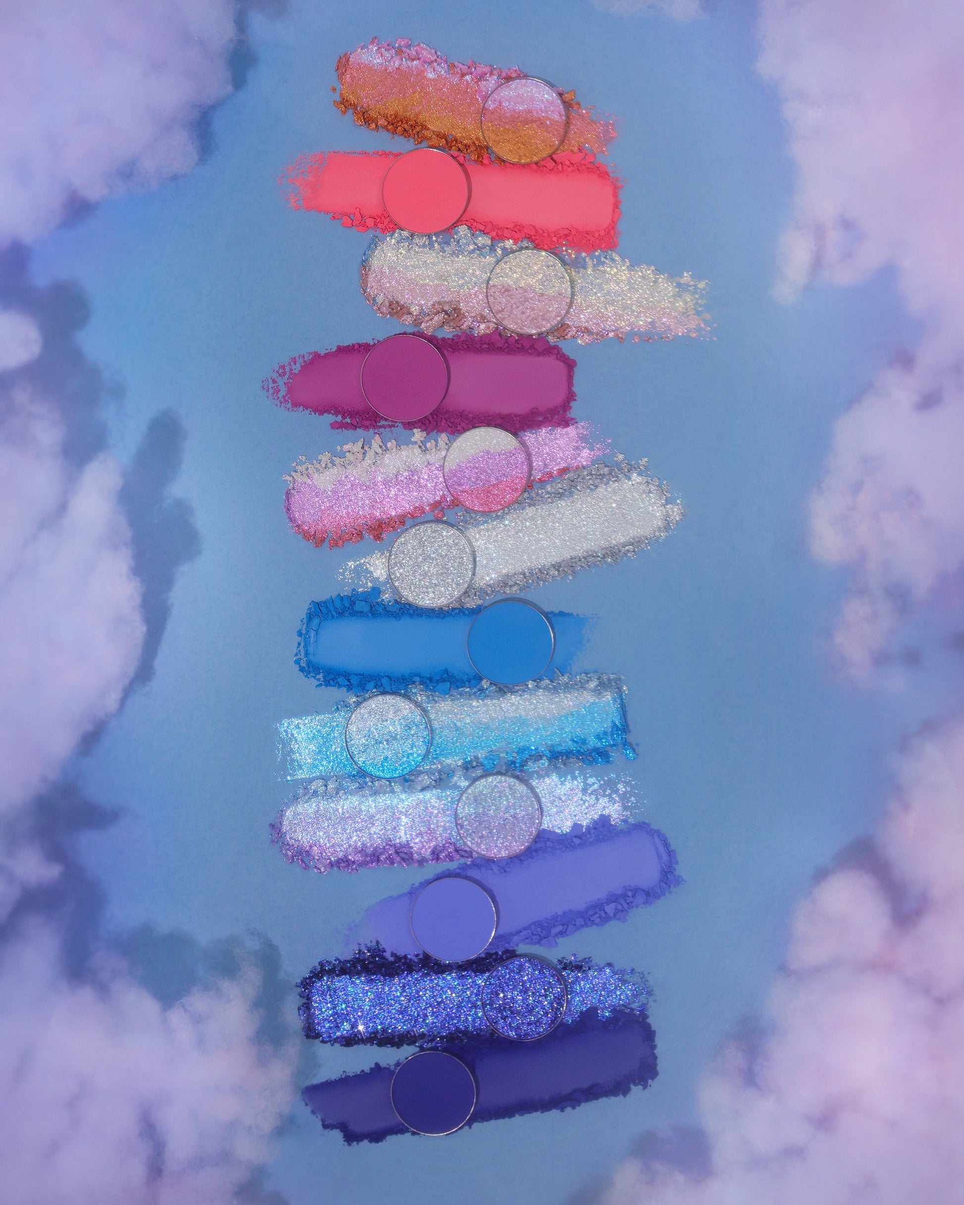 On Cloud 9 shades as swatch smears on a cloud background, coral, pink, silver, and blues
