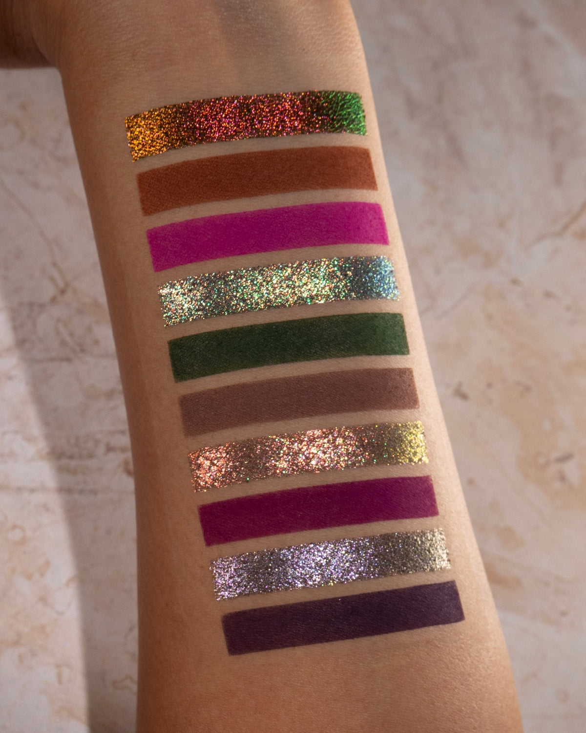 Swatches of the other ten shades on medium skin.