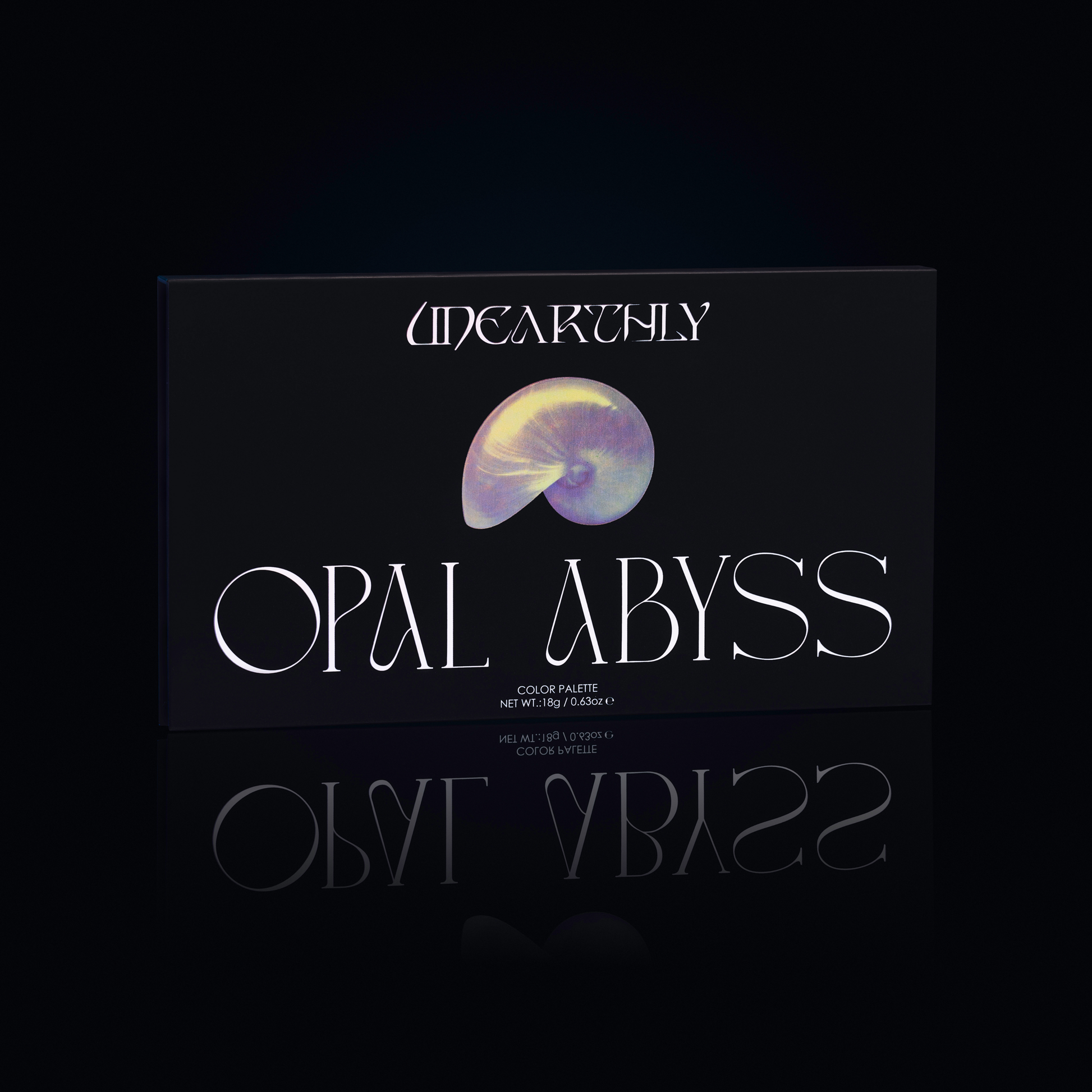 Unearthly Cosmetics Opal Abyss palette closed, black box with iridescent nautilus shell illustration and Opal Abyss lettering