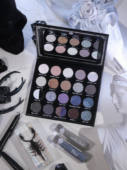 BellaBeauteBar Yin & Yang x Freya86_ff eyeshadow palette open with Flux and Undivided liquid eyeshadows, surrounded by black antlers, preserved scorpion, and white floral statuary