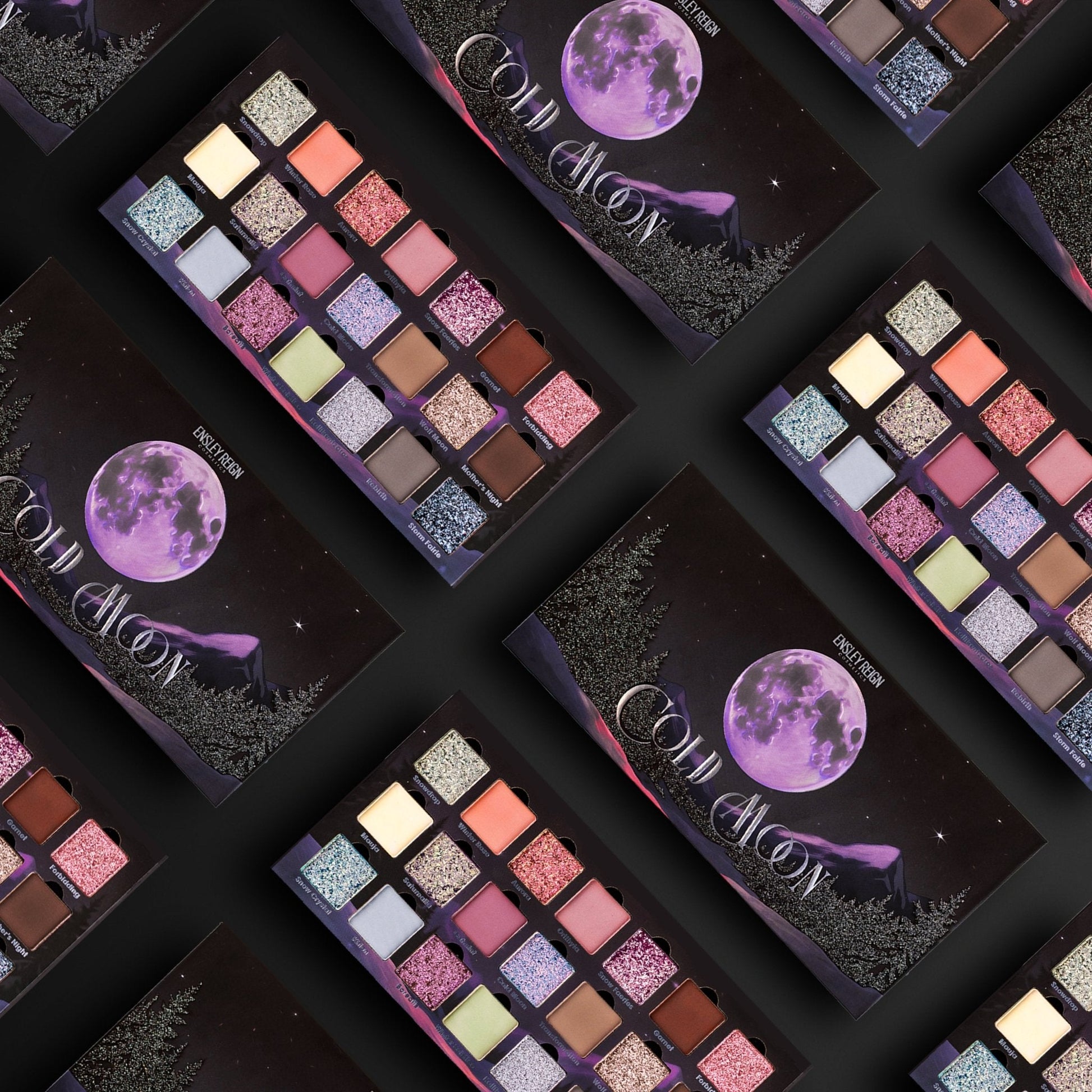 Multiple Ensley Reign Cold Moon palettes arranged in a repeating diagonal pattern, showing the open palette and the purple moon box art