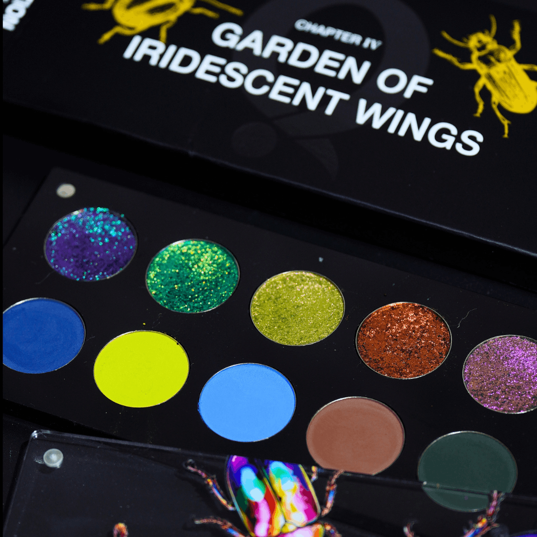 Open palette angled view showing ten pressed pans in two rows, shimmer multichromes on top and matte plus shimmer garden shades below, title visible on lid.