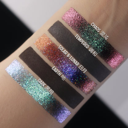 BellaBeauteBar Yin & Yang palette shade swatches — Chaos, Tempered, Solar & Lunar, Earth, and Dark — pink-green duochrome, copper holographic, deep blue-violet glitter, and teal multichrome