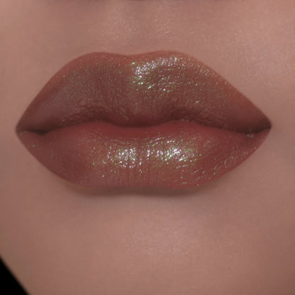 Sheer layer on light-skin lips, brown with a green-gold sheen.