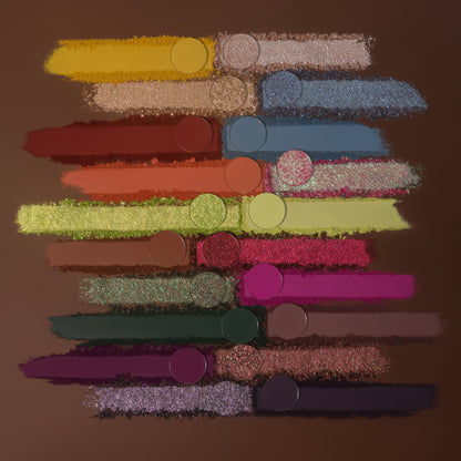 Smears of all 20 shades with their pans on a brown background.