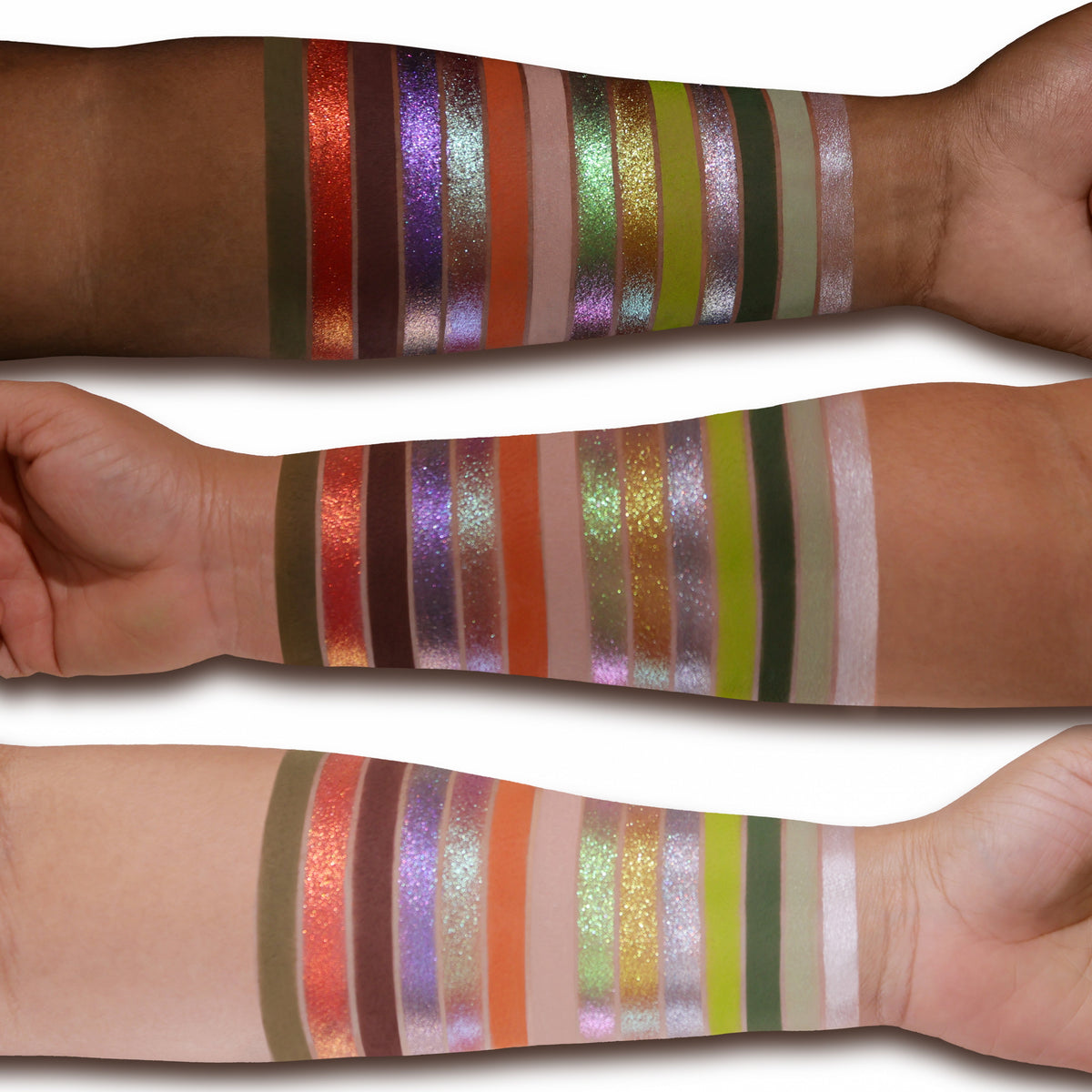 All 14 Coven shades swatched on deep, medium and light skin, from an olive matte through red, purple and gold sparkles to a pale shimmer