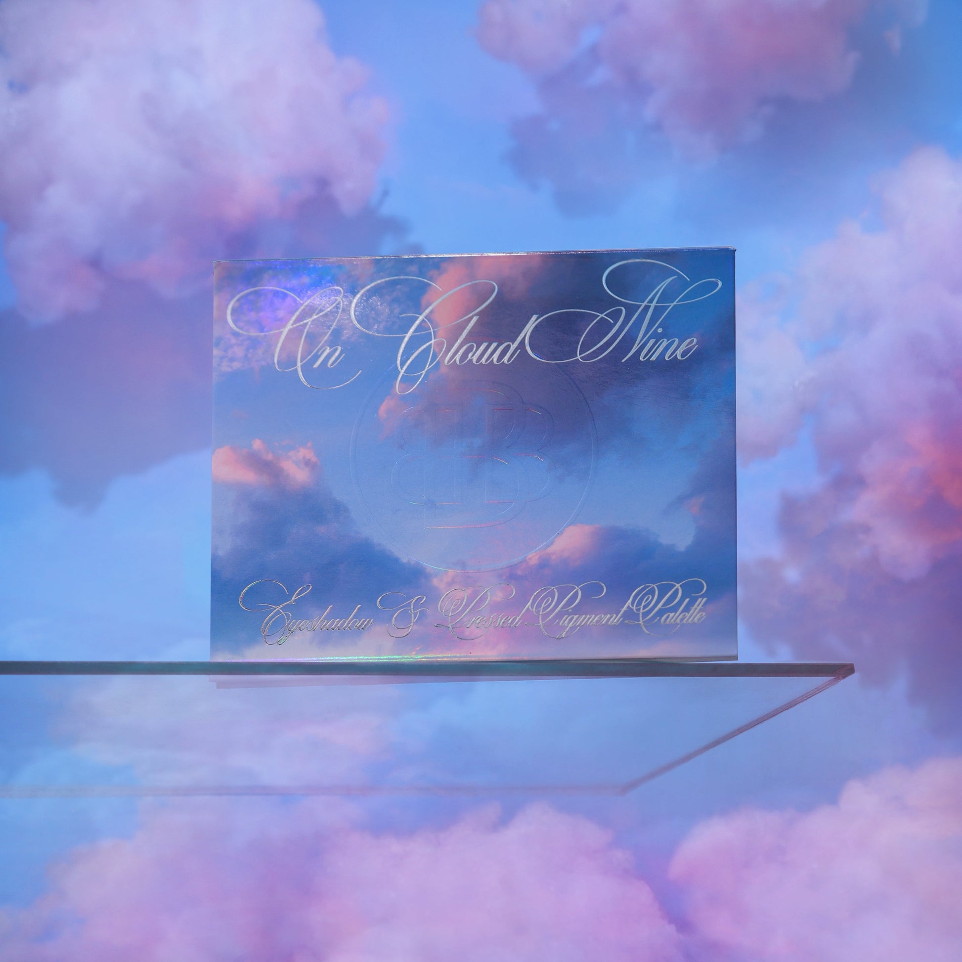 On Cloud 9 palette closed, iridescent cover with On Cloud Nine script in a soft cloud scene
