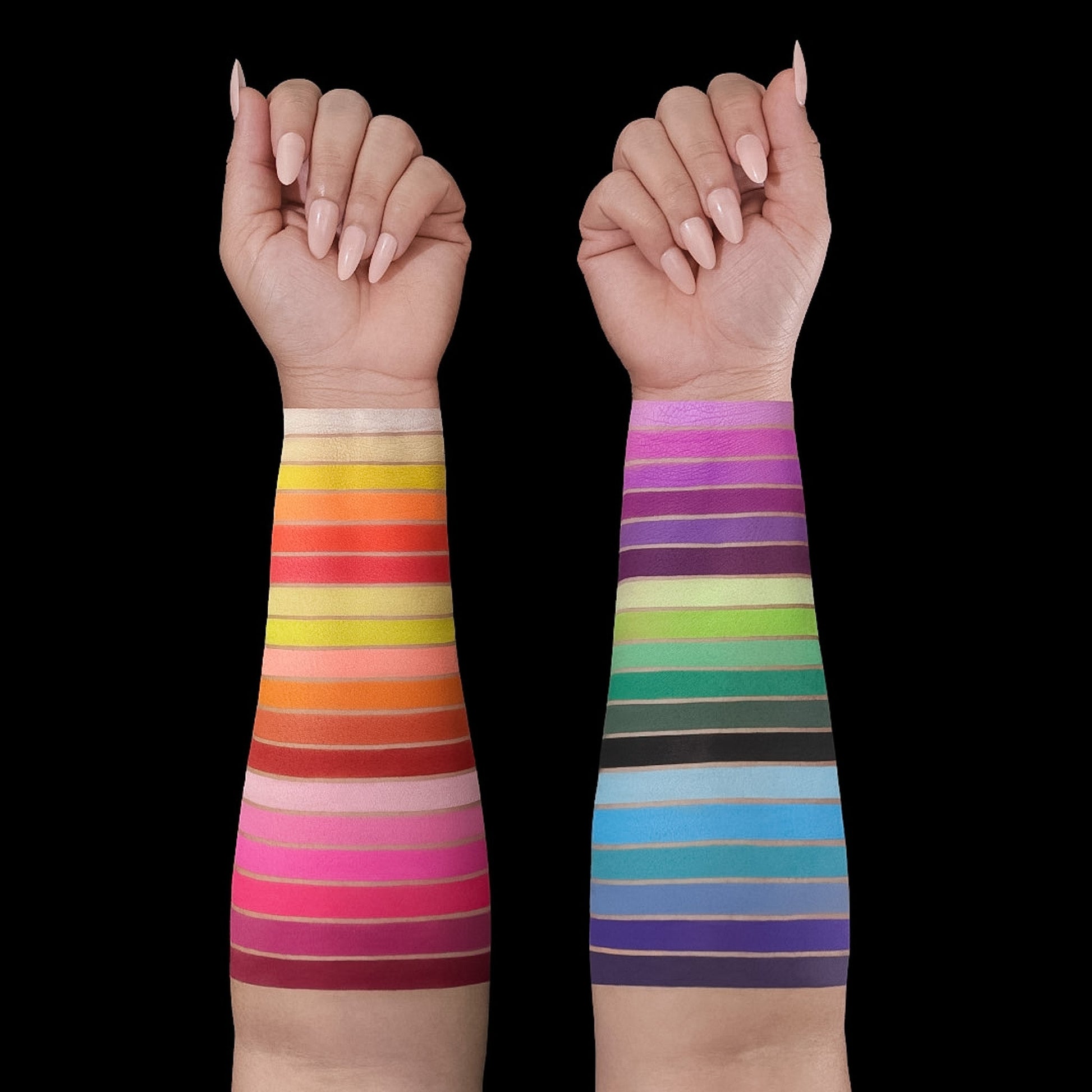 All 36 shades swatched down two forearms on light and medium skin, warm reds and pinks on one arm, cool greens and blues on the other