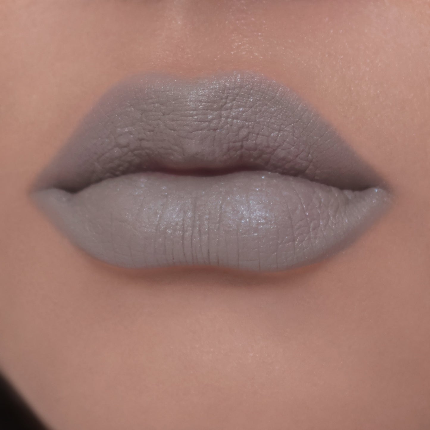 BellaBeauteBar Velvet Veil lip mud in Undivided worn on lips - muted grey green matte finish