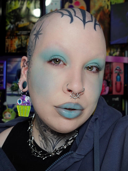 Scary, the bright teal, worn on the lids and lips.