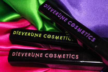 Three closed tubes stacked on green, pink and purple satin, each with the brand logo printed in its own shade.