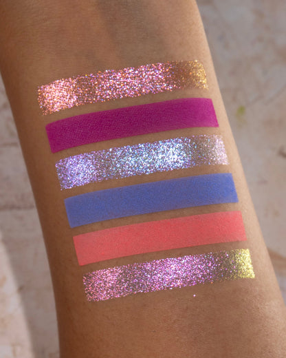 On Cloud 9 shades swatched, magenta, lilac, periwinkle, and coral on skin