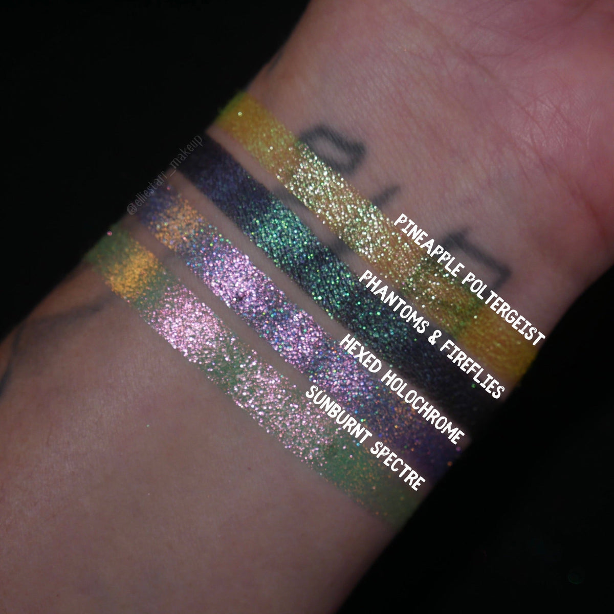 All four Summerween singles swatched on deep skin and labelled, Pineapple Poltergeist at the top