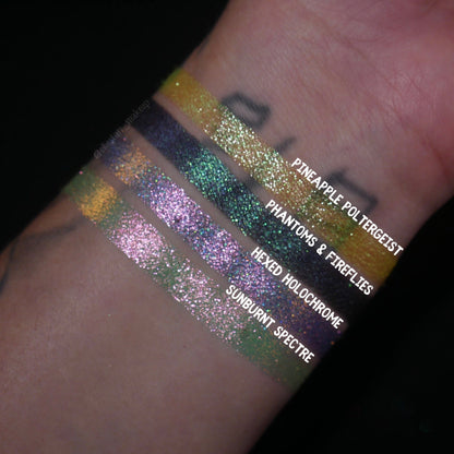 All four Summerween singles swatched on deep skin and labelled, Pineapple Poltergeist at the top