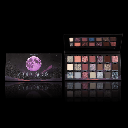 Ensley Reign Cold Moon palette - closed box with purple moon winter artwork alongside open palette showing 21 shades, on black background