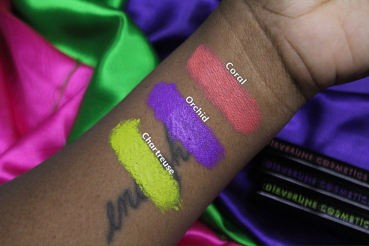 Arm swatches on deep skin against bright satin, labelled Coral, Orchid and Chartreuse.