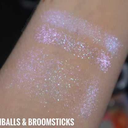 Beachballs and Broomsticks swatched twice on light skin, pressed and blended, with a creator watermark.