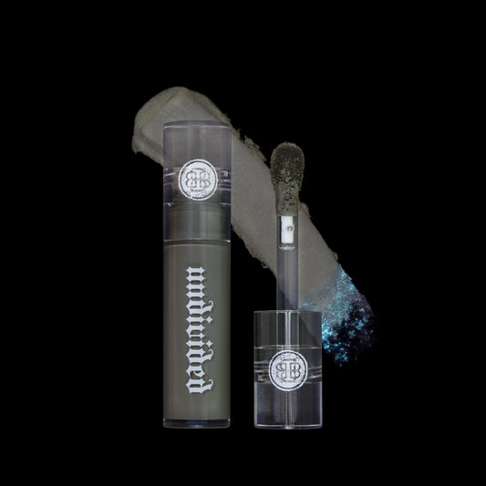 BellaBeauteBar Velvet Veil lip mud in Undivided - open tube with applicator wand and grey green matte swatch with silver shimmer