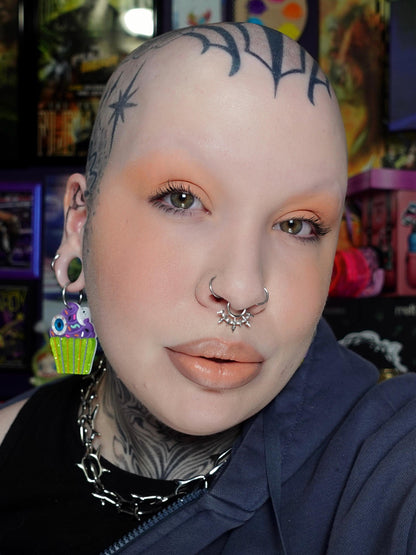 Ghastly, the pastel creamsicle orange, worn on the lids and lips.