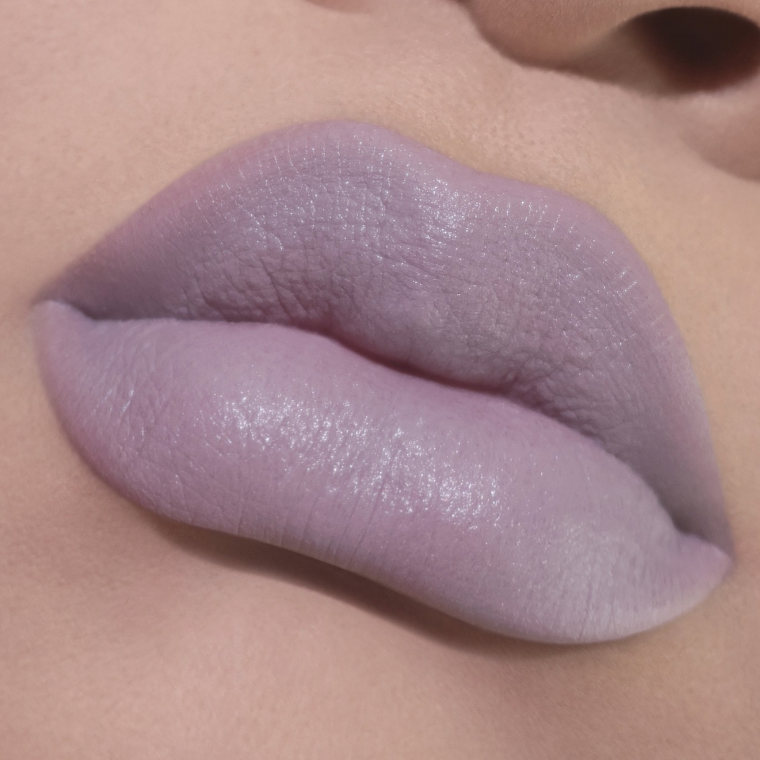 Ghost Milk worn on lips on fair skin, an opaque pale lilac-grey with a soft satin finish