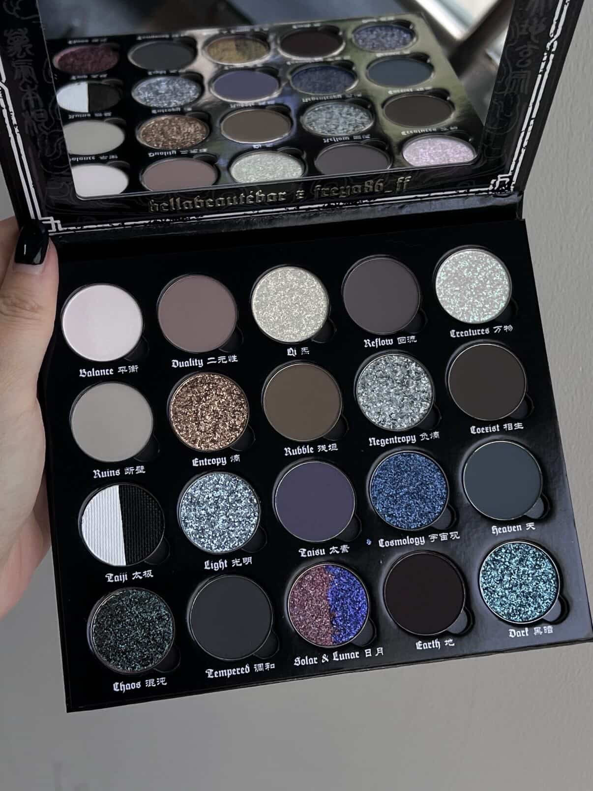 BellaBeauteBar x Freya86_ff Yin & Yang eyeshadow palette held open showing all 20 shades and mirror lid