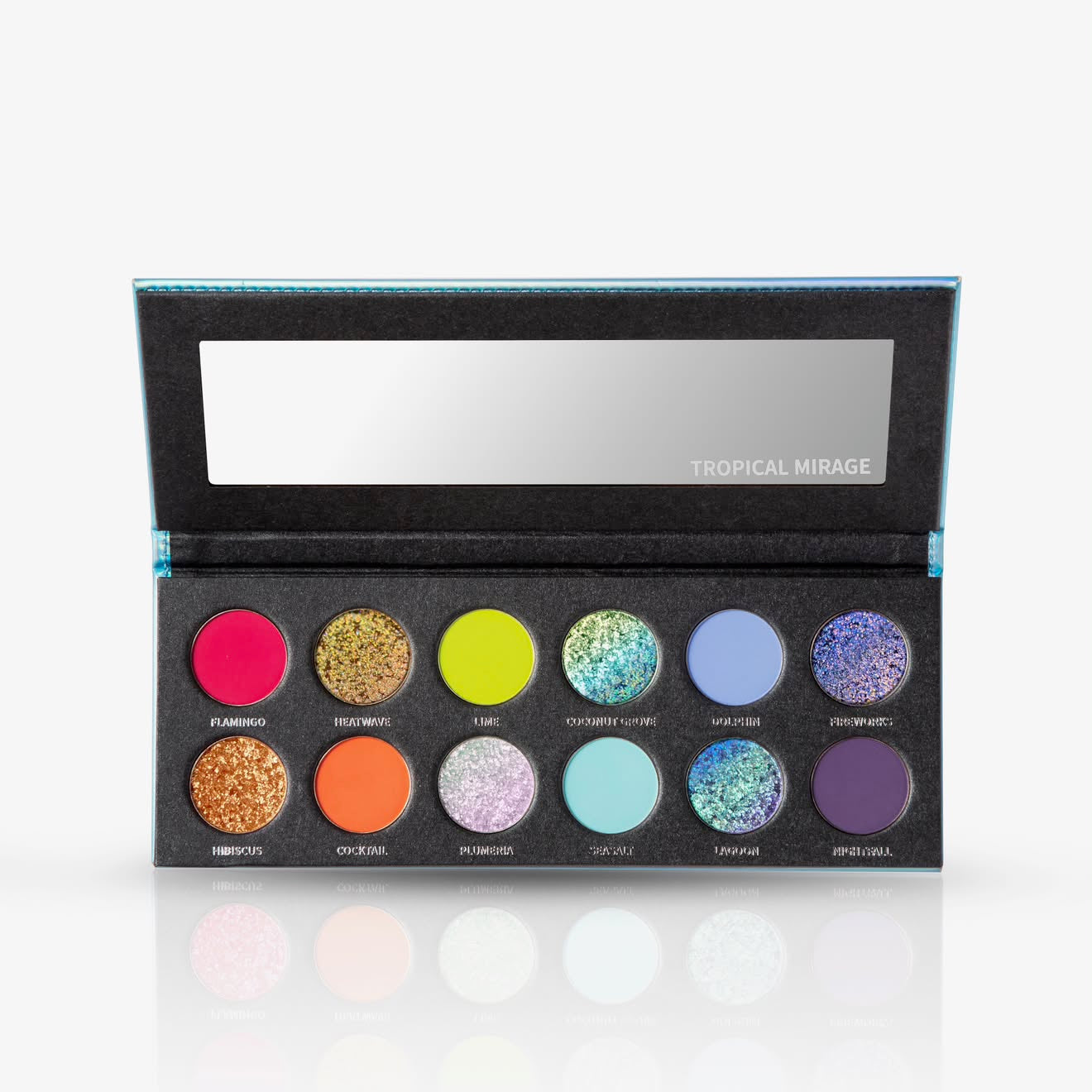 Tropical Mirage palette open on plain white, mirrored lid above 12 labelled pans in two rows of pinks, golds, greens, blues, lilac and deep purple