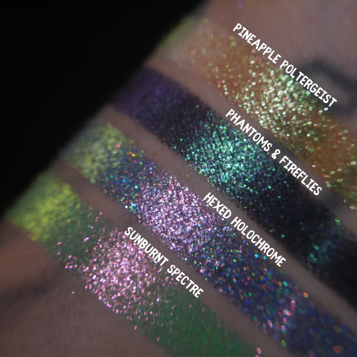 Close-up of all four Summerween singles swatched side by side on deep skin, labelled