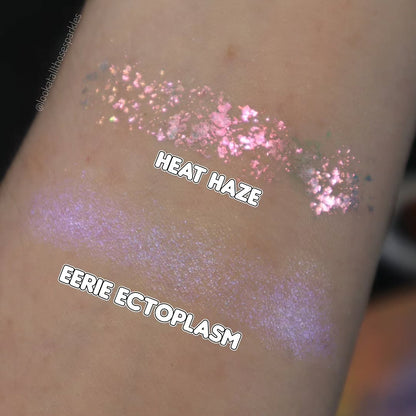 Heat Haze swatched on light skin above Eerie Ectoplasm cream highlighter, labelled