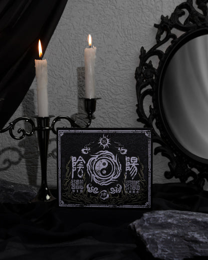 BellaBeauteBar Yin & Yang x Freya86_ff palette cover propped up with black candelabra and ornate mirror in a dark gothic setting