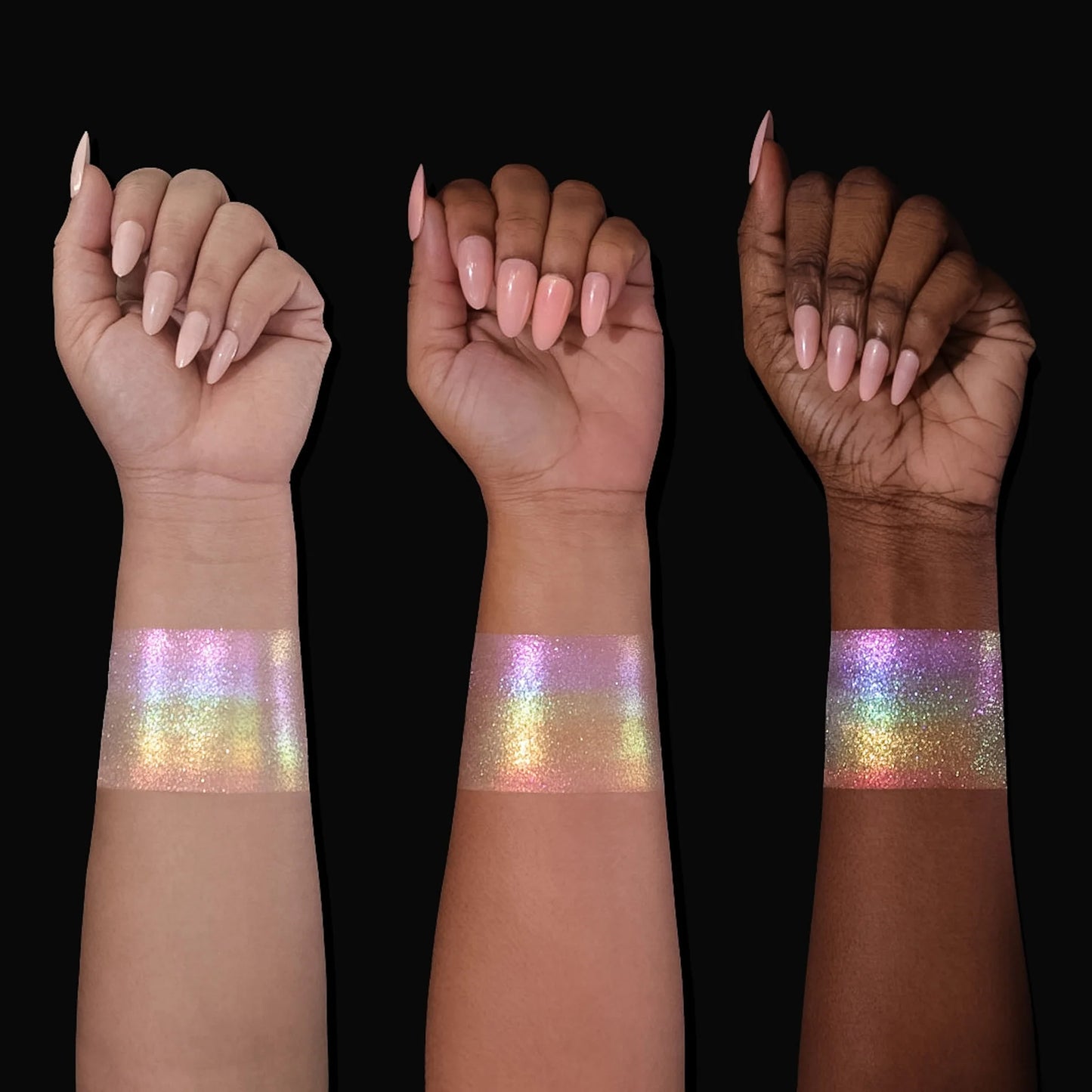 Arch of Color highlighter swatched on light, medium, and deep skin tones, showing an iridescent pink, lilac, gold, and green rainbow shift