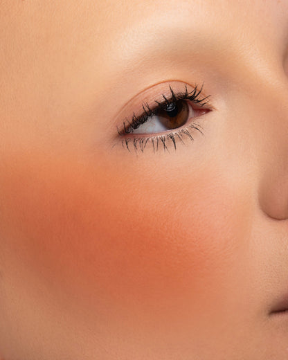 October blended on the cheek as a sheer orange flush, fair skin tone