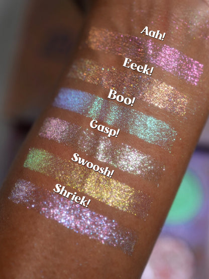 Close-up arm swatches on deep skin, each labelled with its shade name from Aah! down to Shriek!.