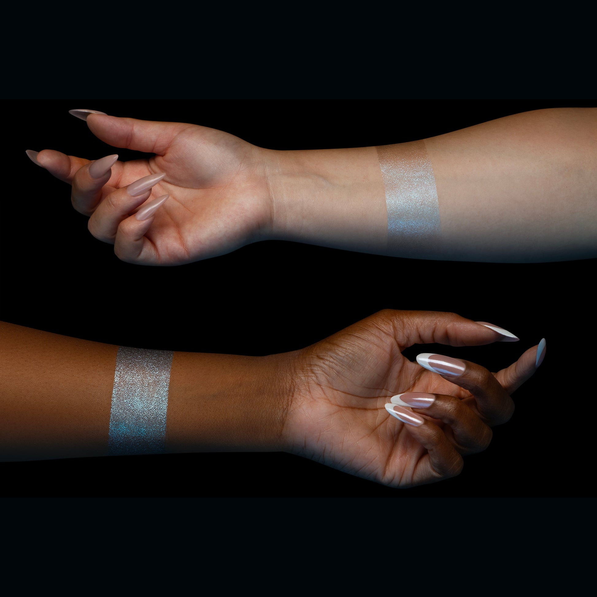 Dewlight silver-blue glow swatched on two skin tones
