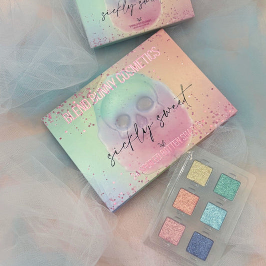 Sickly Sweet shimmers box beside the Sickly Sweet palette box and the open six-pan tray on pale tulle