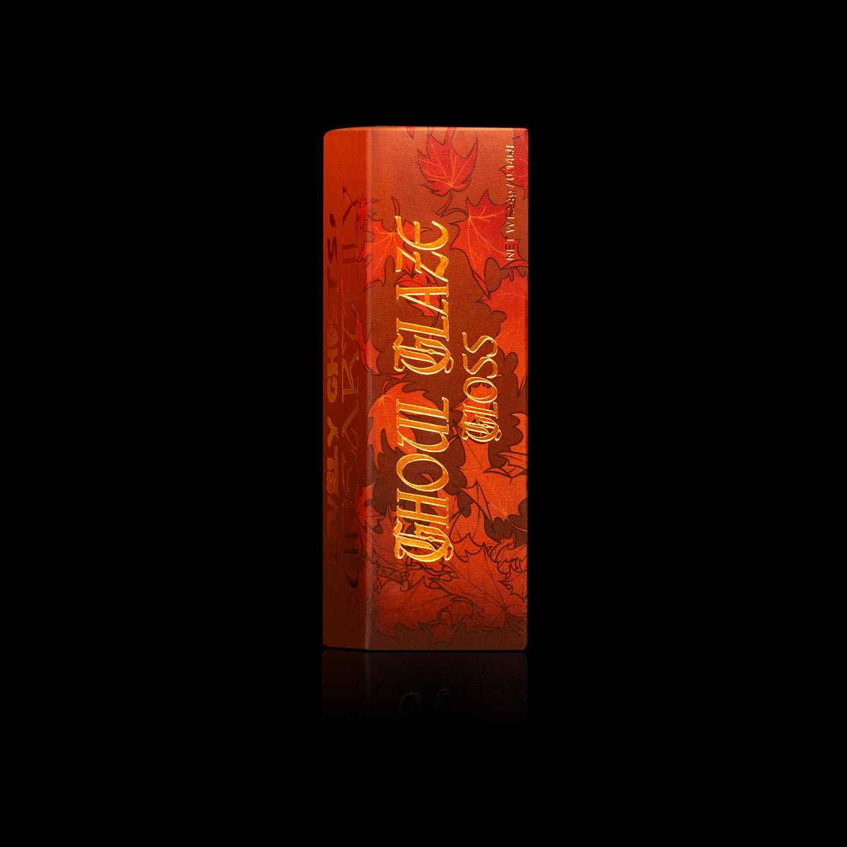 Ghoul Glaze gloss box, burnt orange with a maple leaf print and gold lettering, Lively Ghosts x Unearthly on the side