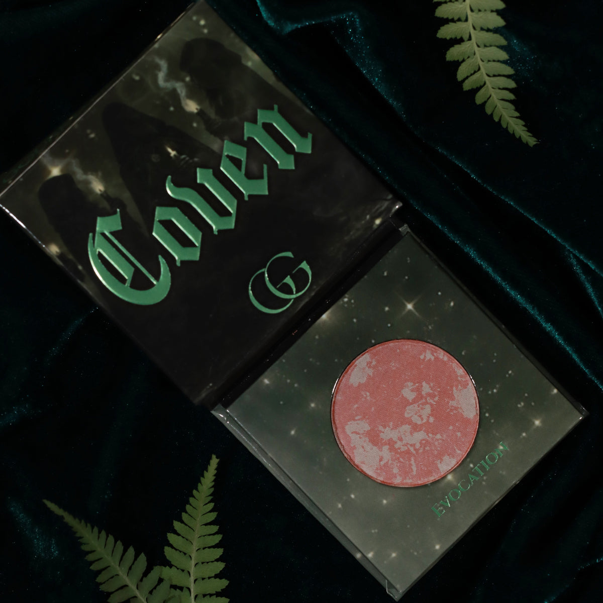 Evocation, a terracotta rose and pale pink marbled pan in the green starry compact beside the Coven box