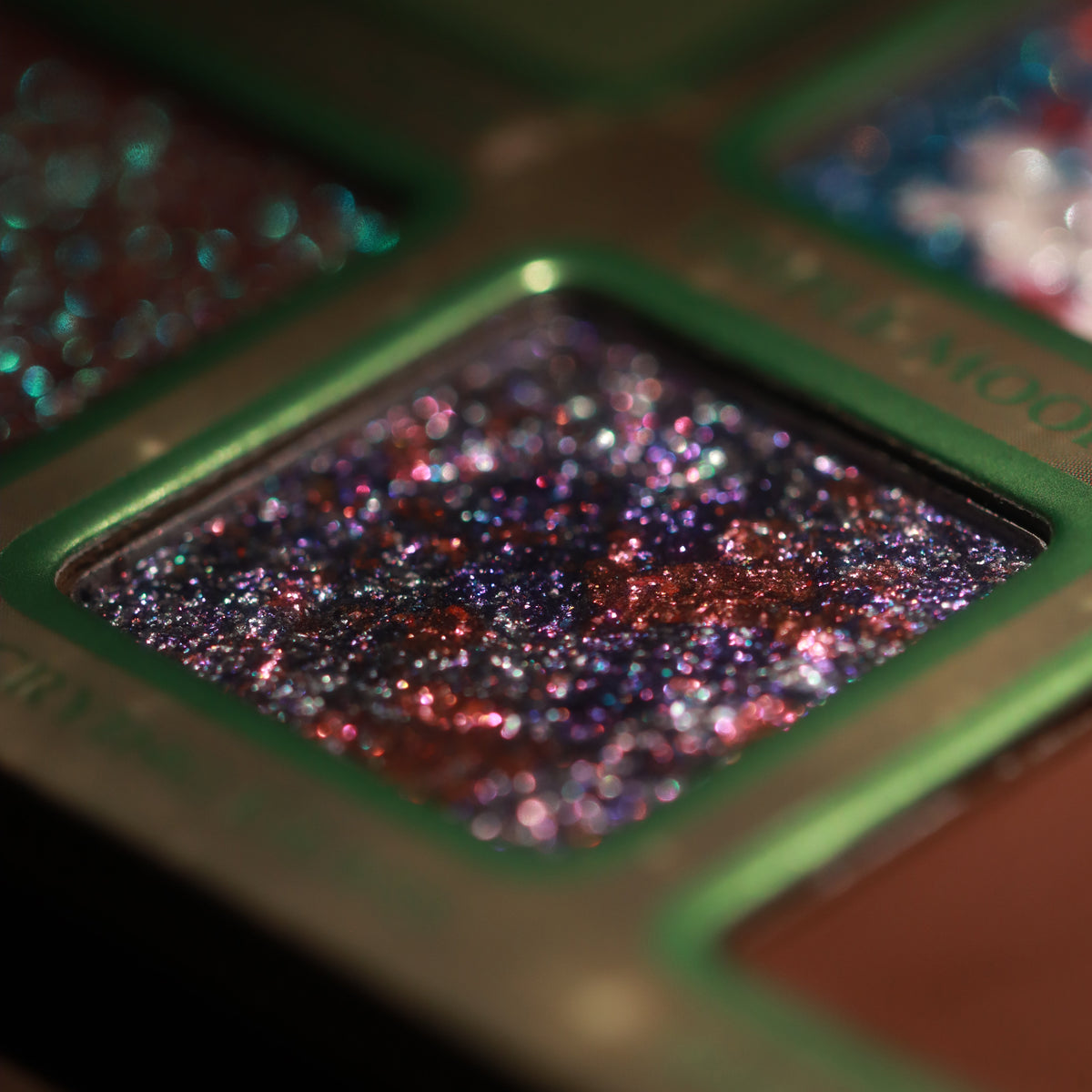Macro of Scrying Glass, purple marbled with pink and red sparkles