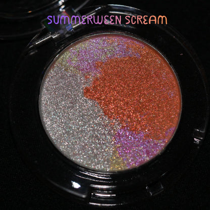 The Summerween Scream pan in a black compact, silver marbling running into orange.