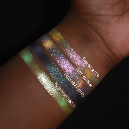 All four Summerween singles swatched on deep skin and labelled, Sunburnt Spectre at the top