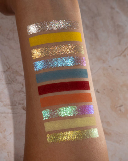 Swatches of half the palette, ten shades, on medium skin.