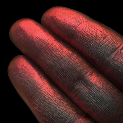 Dark Flame swatch: black base with fiery red shift and holographic sparkle