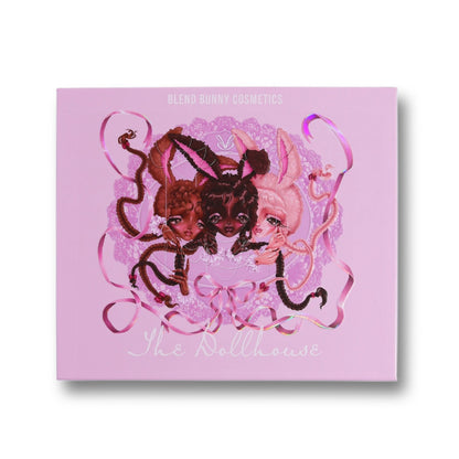 The Dollhouse closed palette, lilac cover with three bunny-eared doll figures, ribbons, and lace artwork