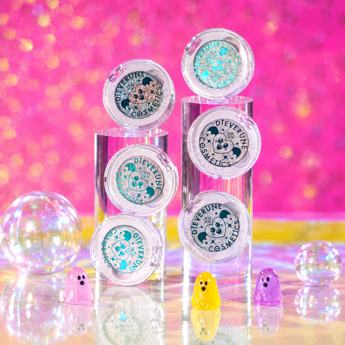 The six Sporkleween singles closed and stacked on clear risers with small ghost figures, from the brand's bundle page