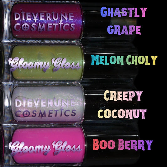 The four Gloomy gloss tubes in a labelled lineup, Ghastly Grape, Melon Choly, Creepy Coconut and Boo Berry from top to bottom