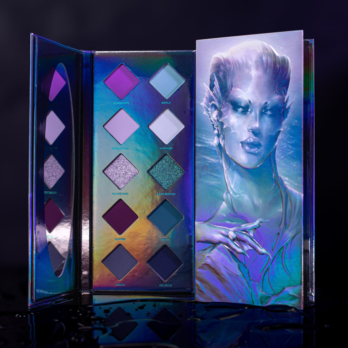 Last Breath mini palette open, ten diamond pans of purples, pale blues, teals and navy on holographic card, siren art on the lid.