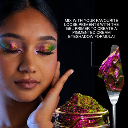 Model with deep skin wearing a pink and green multichrome eye look, beside a spatula of pigment mixed with gel primer into a cream textured formula.